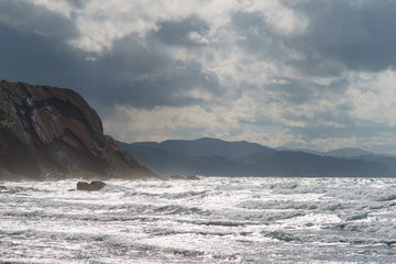 Sun beams over the Atlantic ocean after the rain.