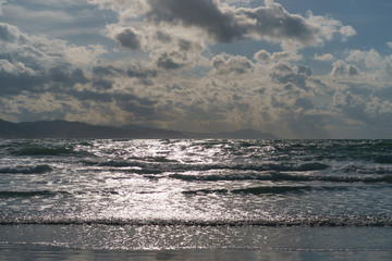 Sun beams over the Atlantic ocean after the rain.