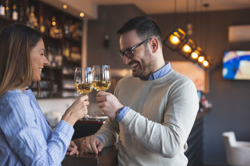 Couple in a restaurant making a toast