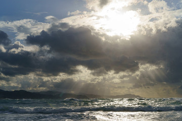 Sun beams over the Atlantic ocean after the rain.