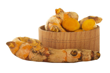 heap of turmeric in wooden cup isolated on white background