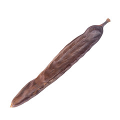 dried long carob pod isolated on white background