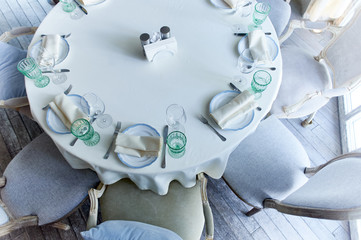 Classic table setting at the Banquet. Glasses of light green glass. wedding Banquet.