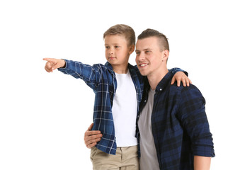 Fototapeta premium Portrait of happy father and son on white background