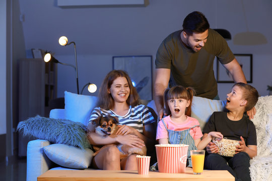 Family Watching Scary Movie In Evening