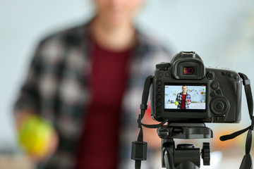 Food blogger recording video at home