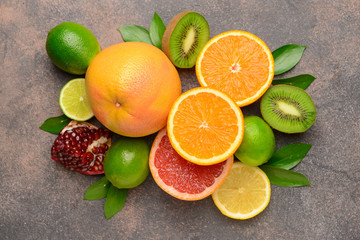 Different fresh fruits on grunge background