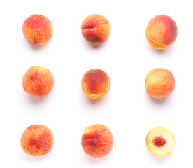 Ripe peaches on white background