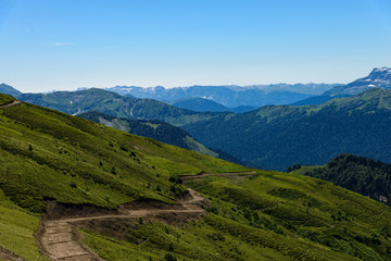Fototapeta na wymiar landscape with going to the mountains road