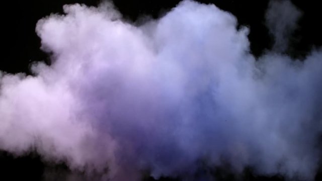 Color Burst - colorful smoke powder explosion fluid ink particles slow motion alpha matte isolated on black background.
