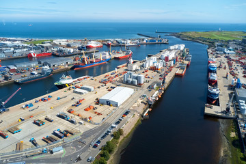 Aerial view of Aberdeen harbour ships with oil & gas tanks and sea vessels