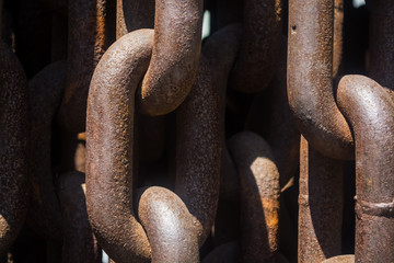 Background or texture from big metal and rusty chains and links.
