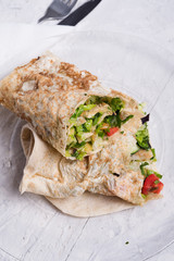 vegetarian halfs of shawarma sandwich roll. served in provence style. Healthy fast food. close up.