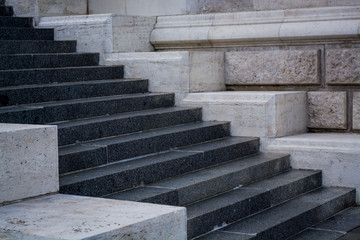 Gray and monophonic concrete steps. Stone walls. Old architecture. Background.