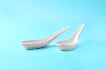Clean Miso soup spoons on blue background