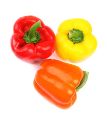 Fresh ripe bell peppers on white background, top view