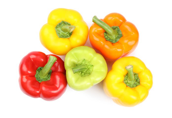 Fresh ripe bell peppers on white background, top view