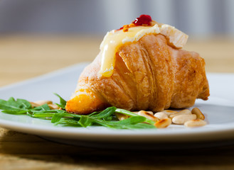 Mini croissant with camembert, jam, pine nuts