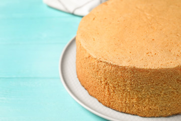 Delicious fresh homemade cake on light blue wooden table, closeup