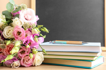 Composition with flowers for Teacher's day on wooden table