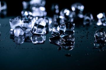ice cubes reflection on black background. close up
