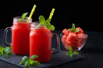 Cold watermelon juice and sliced watermelon