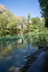 Fototapeta na wymiar View of the Huecar river bank as it passes through Cuenca, Spain, Europe