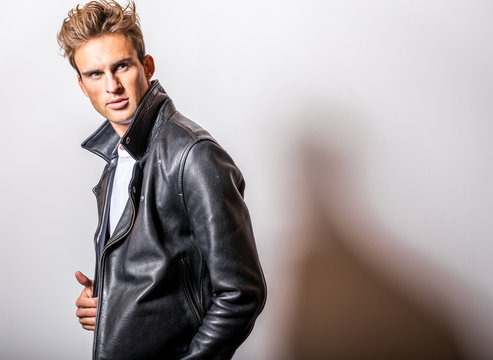 Handsome young man in classic leather jacket.