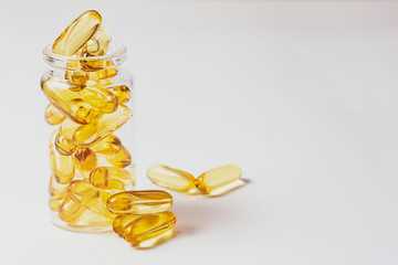 Fish oil capsules isolated on white background. Healthy lifestyle concept.