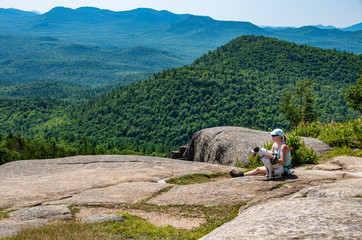 Woman and dog on Poke-O-Moonshine moutain
