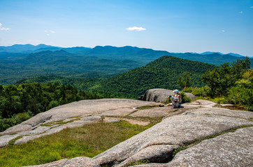 Woman and dog on Poke-O-Moonshine moutain