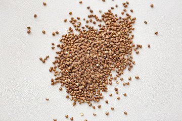 Pile of buckwheat isolated on white background. Top view.