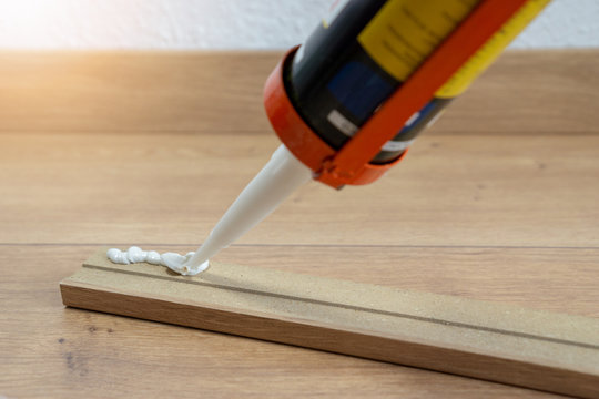 glue for fitting of skirting or washboard, laminate floor, renovation of the house