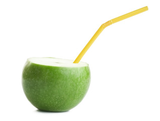 Photo of green apple with a straw