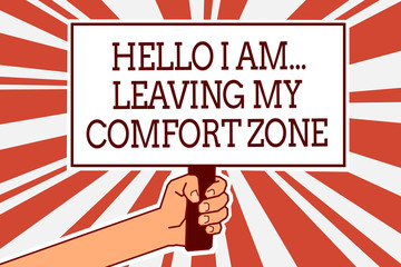 Writing note showing Hello I Am... Leaving My Comfort Zone. Business photo showcasing Making big changes Evolution Growth Man hand holding poster important protest green orange rays background