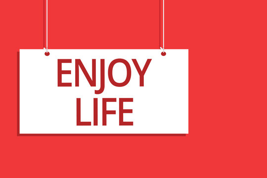 Word writing text Enjoy Life. Business concept for Any thing, place,food or person, that makes you relax and happy Hanging board message communication open close sign orange background