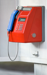 Red telephone with blue handset