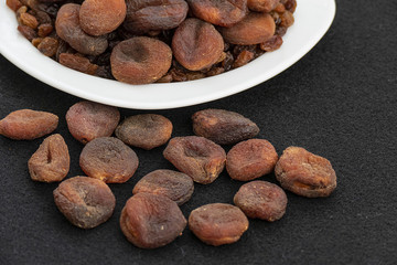 dried apricots, day dry on a plate apricots, dired apricots specific natural turkey,