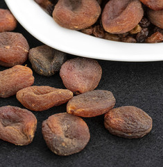 Obraz premium dried apricots, day dry on a plate apricots, dired apricots specific natural turkey,