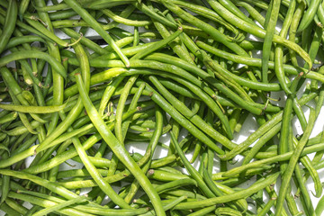 Many fresh green pods in street fair
