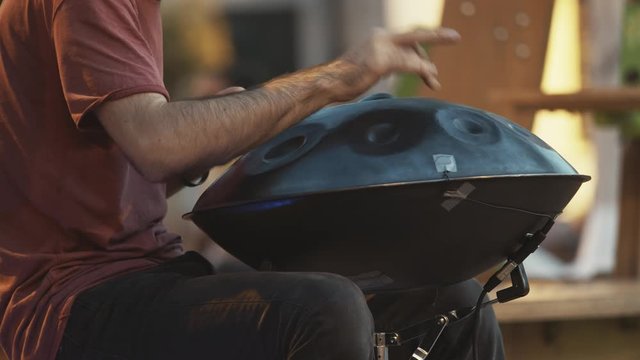 Slow motion handpan street artist in sing on the streets of Timisoara city, Romania
