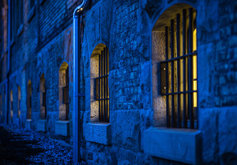 jail bars on windows at night