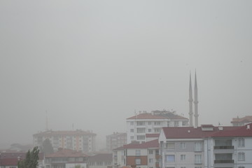 Fototapeta na wymiar dust storm in the city, natural events, city and dust storm,