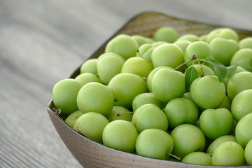 sour green plums, double bunch of plums