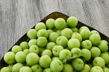 sour green plums, double bunch of plums