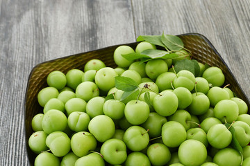sour green plums, double bunch of plums