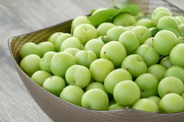 sour green plums, double bunch of plums