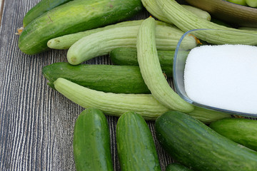 fresh organic cucumbers, green sour plums and salt,