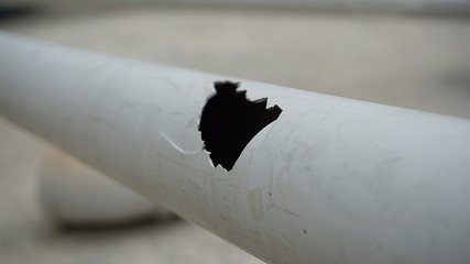 broken plastic water pipe, deformed water pipe,