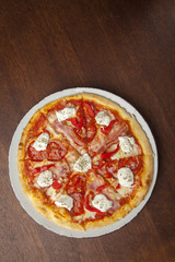 pizza with hot sausage and bacon
